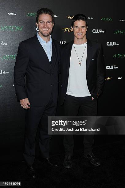 Stephen Amell and Robbie Amell arrive at a special screening for the CW's "Arrow" And "The Flash" at Crest Theatre on November 22, 2014 in Westwood,...