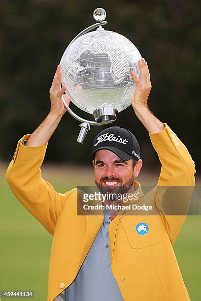 Nick Cullen of Australia holds up the trophy after winning during day four of the Australian Masters at The Metropolitan Golf Course on November 23,...