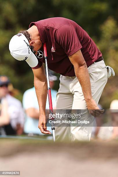 Adam Scott of Australia reacts after just missing a putt on the 16th green to tie for the lead during day four of the Australian Masters at The...