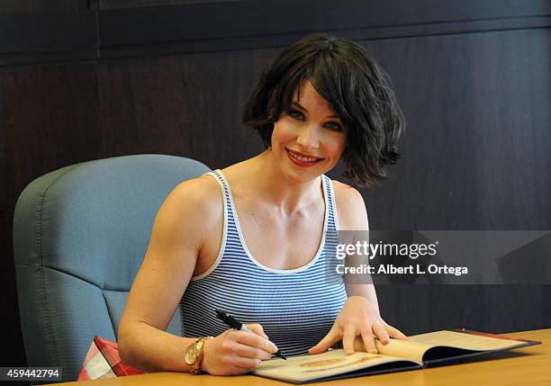 Actress/author Evangeline Lilly signs "The Squickerwonkers" held at Barnes & Noble bookstore at The Grove on November 22, 2014 in Los Angeles,...