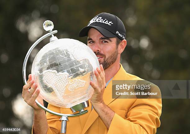 Nick Cullen of Australia kisses the trophy after winning the tournament during day four of the Australian Masters at The Metropolitan Golf Course on...