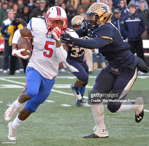 DeMathas Anthony McFarland looked to get away from Good Counsels Darius Fullwood in the second quarter in the Washington Catholic Athletic Conference...