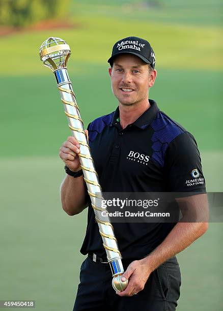 Henrik Stenson of Sweden proudly holds the DP World Tour Championship trophy after his two shot victory during the final round of the 2014 DP World...