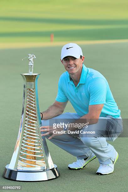 Rory McIlroy of Northern Ireland proudly holds the European Tour Race To Dubai Trophy after the final round of the 2014 DP World Tour Championship at...