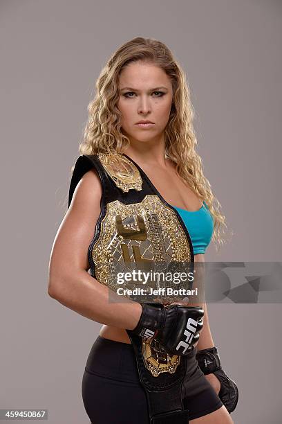 Women's Bantamweight Champion Ronda Rousey poses for a portrait during a UFC photo session on December 26, 2013 in Las Vegas, Nevada.