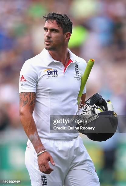 Kevin Pietersen of England leaves the field after being bowled by Mitchell Johnson of Australia during day two of the Fourth Ashes Test Match between...