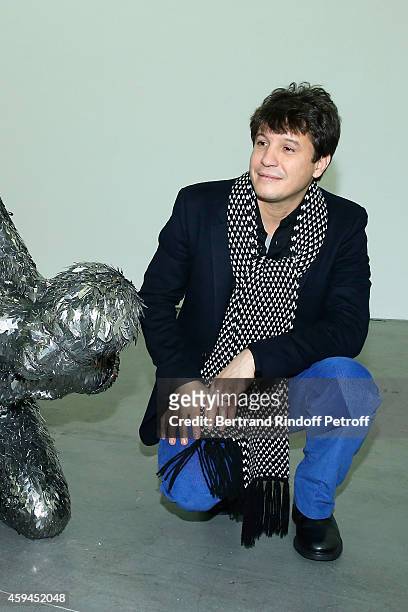 Contemporary artist Adel Abdessemed poses with his sculpture ,a self-portrait representation of his beheading by his father during a closing party...