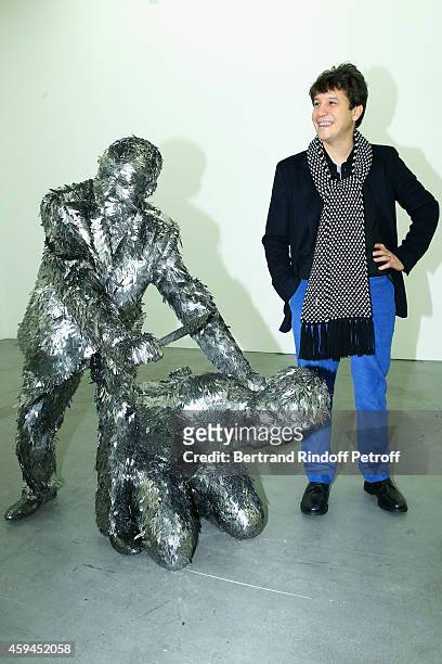 Contemporary artist Adel Abdessemed poses with his sculpture, a self-portrait representation of his beheading by his father during a private view in...