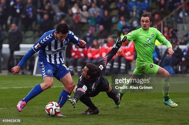 Ilian Micanski of Karlsruhe is challenged by goalkeeper Martin Maennel of Aue during the Second Bundesliga match between Karlsruher SC and Erzgebirge...