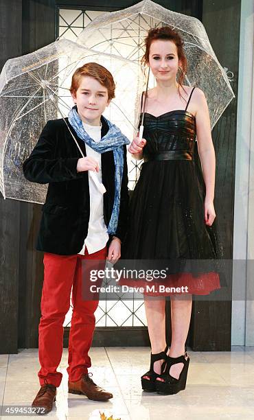 Samuel Joslin and Madeleine Harris attend the World Premiere of "Paddington" at Odeon Leicester Square on November 23, 2014 in London, England.