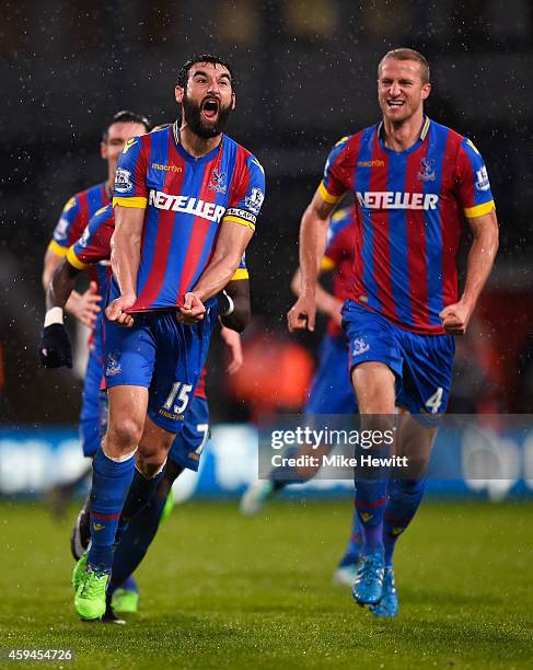 Mile Jedinak of Crystal Palace celebrates scoring his team's third goal with team mates during the Barclays Premier League match between Crystal...