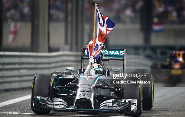 Lewis Hamilton of Great Britain and Mercedes GP celebrates in the car after winning the World Championship and the Abu Dhabi Formula One Grand Prix...