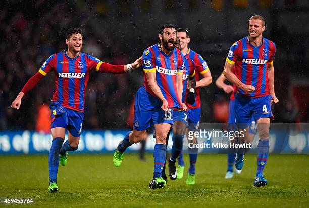 Mile Jedinak of Crystal Palace celebrates scoring his team's third goal with team mates during the Barclays Premier League match between Crystal...
