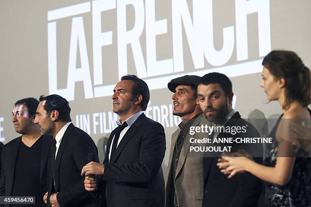 French actors Gilles Lellouche , Jean Dujardin and Guillaume Gouix attend the premiere of the film "La French" at the Prado cinema in Marseille on...