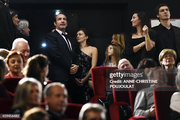 French actors Jean Dujardin and Celine Sallette attend the premiere of the film "La French" by French director Cedric Jimenez at the Prado cinema in...