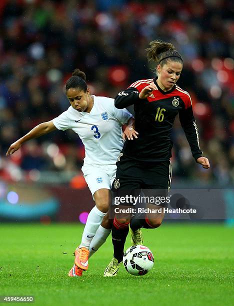 Demi Stokes of England and Melanie Leupolz of Germany battle for the ball during the Women's International Friendly match between England and Germany...