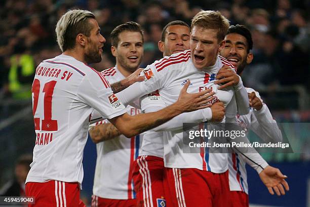 Artjoms Rudnevs of Hamburg celebrates scoring the opening goal with his team mates during the Bundesliga match between Hamburger SV and SV Werder...