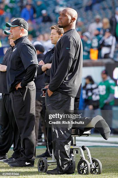 An injured DeMeco Ryans of the Philadelphia Eagles watches the team warm-up before playing against the Tennessee Titans at Lincoln Financial Field on...
