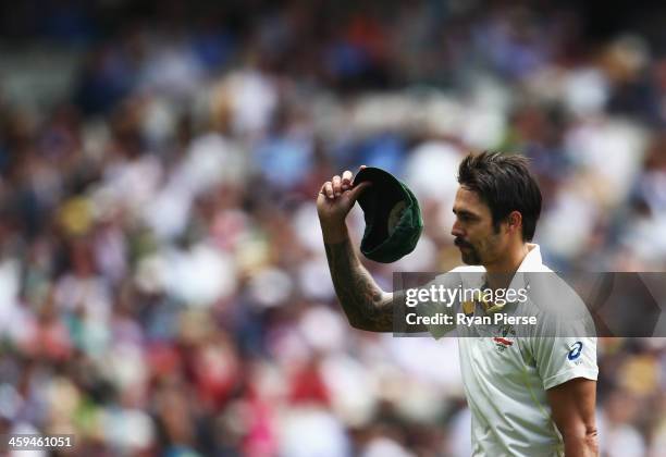 Mitchell Johnson of Australia waves his cap after claiming his fifth wicket during day two of the Fourth Ashes Test Match between Australia and...