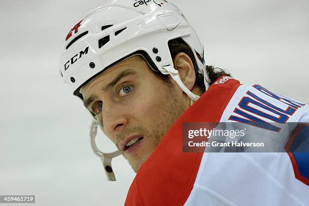 Aaron Volpatti of the Washington Capitals against the Carolina Hurricanes during their game at PNC Arena on December 20, 2013 in Raleigh, North...