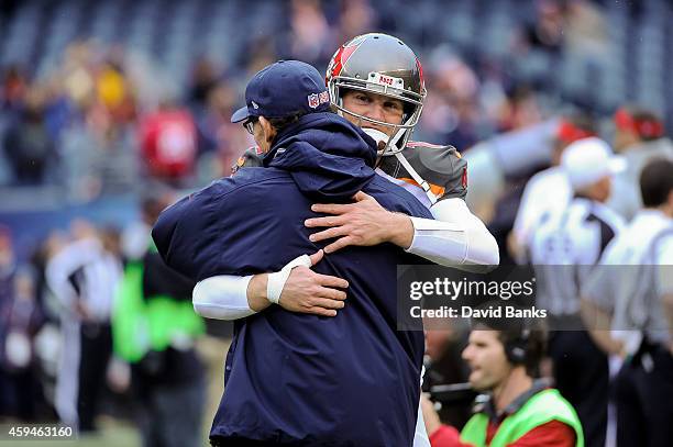 Quarterback Josh McCown of the Tampa Bay Buccaneers hugs his former head coach Marc Trestman of the Chicago Bears, during warm-ups at Soldier Field...