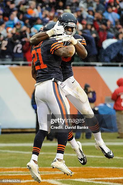 Strong safety Ryan Mundy of the Chicago Bears celebrates with inside linebacker Christian Jones after intercepting the football intended for running...