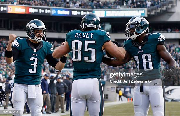 James Casey of the Philadelphia Eagles celebrates a touchdown with teammates Mark Sanchez and Jeremy Maclin against the Tennessee Titans during the...