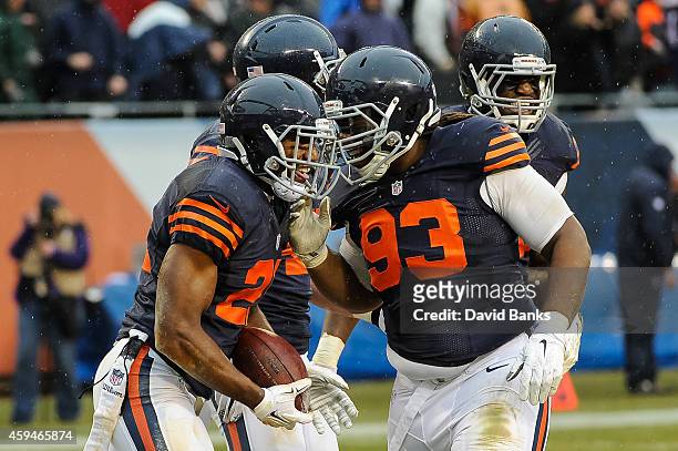 Strong safety Ryan Mundy of the Chicago Bears celebrates with defensive tackle Will Sutton after intercepting the football intended for running back...