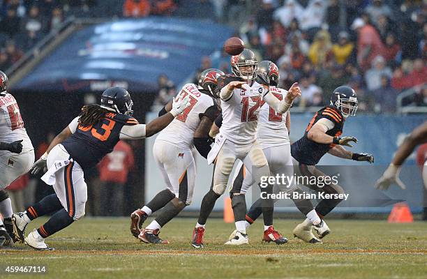 Quarterback Josh McCown of the Tampa Bay Buccaneers throws as defensive tackle Will Sutton of the Chicago Bears pressures him during the fourth...