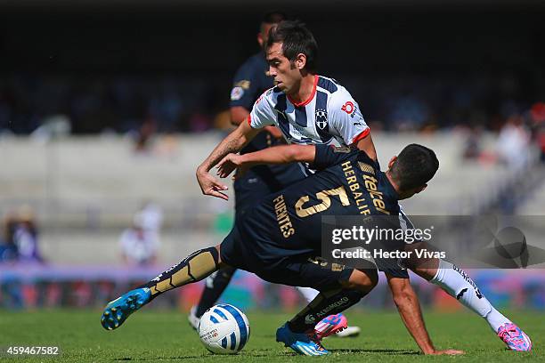 Luis Fuentes of Pumas struggles for the ball with Cesar Delgado of Monterrey during a match between Pumas UNAM and Monterrey as part of 17th round...