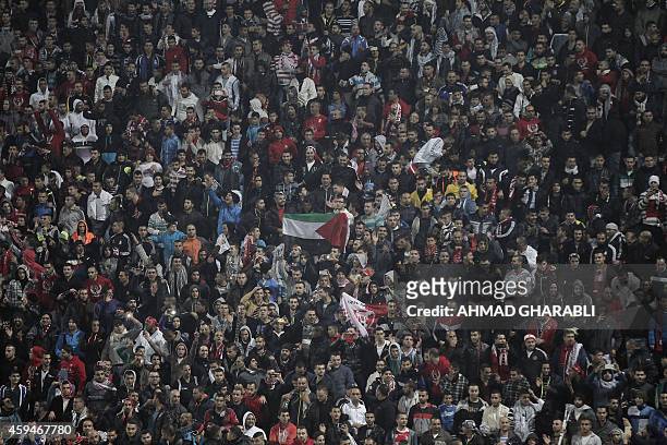Arab-Israeli supporters of Bnei Sakhnin, the only Arab team in the Israeli Premier league, cheer on their team during their football match against...