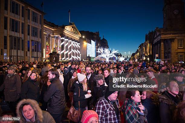 People attending the shows during Light Night, the event that celebrates the inauguration of Christmas Time in Edinburgh, at George Street on...