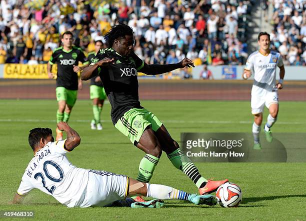 Obafemi Martins of Seattle Sounders FC has his pass blocked by A.J. DeLaGarza of Los Angeles Galaxy during the Western Conference Final at StubHub...