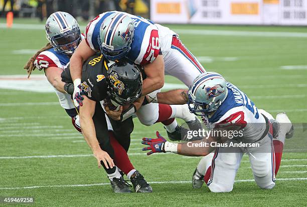 Zach Collaros of the Hamilton Tiger-Cats is brought down short of the goal line against the Montreal Alouettes during the CFL football Eastern...