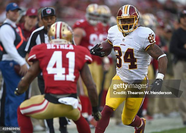 Niles Paul of the Washington Redskins looks to get past Antoine Bethea of the San Francisco 49ers at Levi's Stadium on November 23, 2014 in Santa...