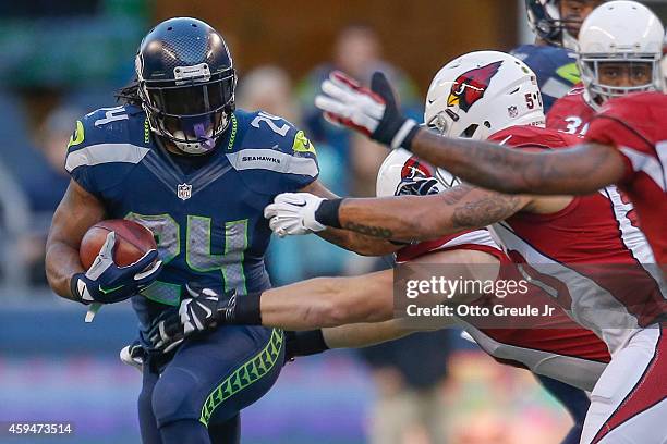 Running back Marshawn Lynch of the Seattle Seahawks rushes against the Arizona Cardinals at CenturyLink Field on November 23, 2014 in Seattle,...