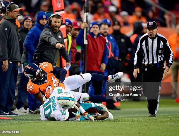 Wide receiver Brandon Gibson of the Miami Dolphins gets a first down during the third quarter. The Denver Broncos played the Miami Dolphins at Sports...