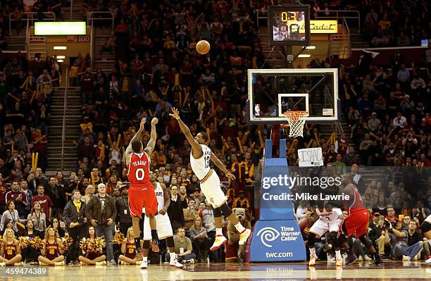 Jeff Teague of the Atlanta Hawks shoots the game winning basket in double overtime against Tristan Thompson of the Cleveland Cavaliers at Quicken...