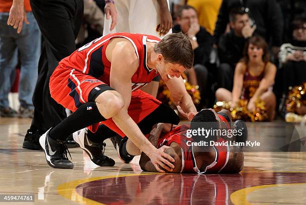 Kyle Korver of the Atlanta Hawks congratulates teammate Jeff Teague after he hit the game winner in double overtime against the Cleveland Cavaliers...