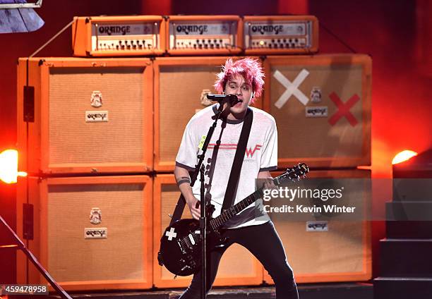 Recording artist Michael Clifford of 5 Seconds of Summer performs onstage at the 2014 American Music Awards at Nokia Theatre L.A. Live on November...