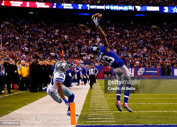 Odell Beckham of the New York Giants scores a touchdown in the second quarter against the Dallas Cowboys at MetLife Stadium on November 23, 2014 in...