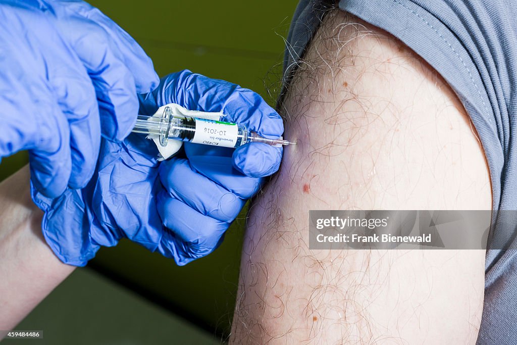 A injection of fluid medicine into a patients arm is done by...