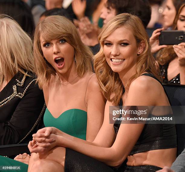 Karlie Kloss and Taylor Swift attend the 2014 American Music Awards at Nokia Theatre L.A. Live on November 23, 2014 in Los Angeles, California.