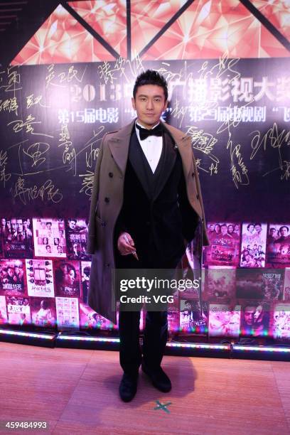Actor Huang Xiaoming attends the 15th China Huabiao Film Awards at China Central Television Headquarters on December 26, 2013 in Beijing, China.