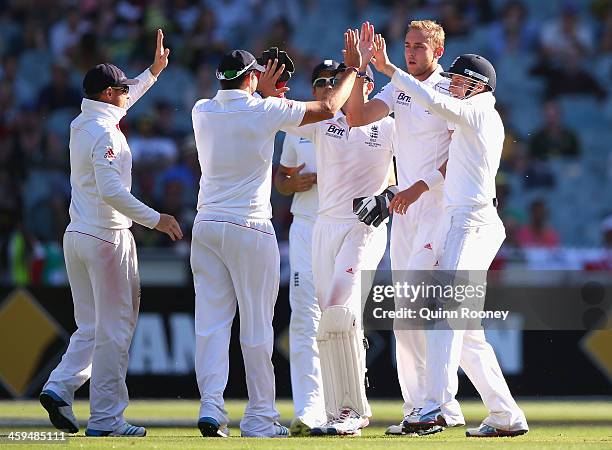 Stuart Broad of England is congratulated by team mates after taking the wicket of Peter Siddle of Australia during day two of the Fourth Ashes Test...