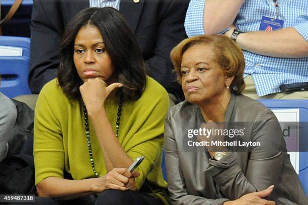 First lady Michelle Obama and Marian Robinson watch a women's college basketball game between the Princeton Tigers and the American University Eagles...