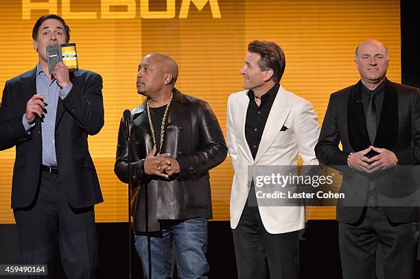 Personalities Mark Cuban, Daymond John, Robert Herjavec and Kevin O'Leary speak onstage at the 2014 American Music Awards at Nokia Theatre L.A. Live...
