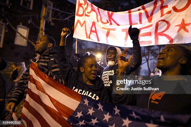 Demonstrators march through the streets while protesting the shooting death of 18-year-old Michael Brown on November 23, 2014 in St. Louis, Missouri....