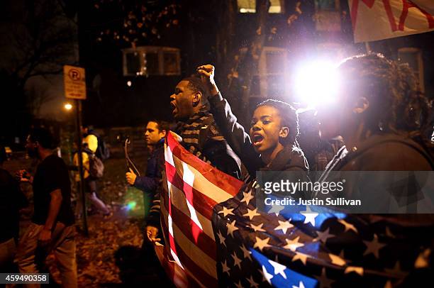 Demonstrators march through the streets while protesting the shooting death of 18-year-old Michael Brown on November 23, 2014 in St. Louis, Missouri....