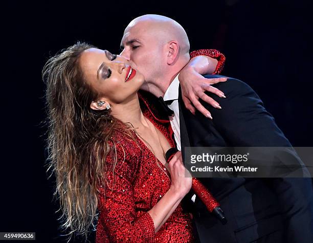 Recording artist Jennifer Lopez and host Pitbull perform onstage at the 2014 American Music Awards at Nokia Theatre L.A. Live on November 23, 2014 in...